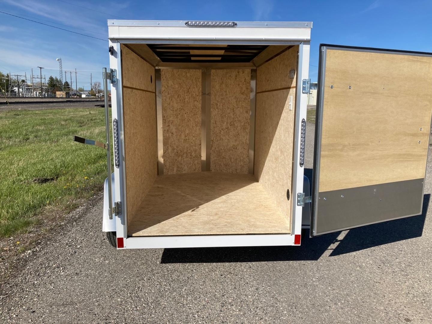 2024 Pace , located at 310 West 1st Ave, Big Timber, MT, 59011, (406) 860-8510, 45.833511, -109.957809 - Pace American Outback DLX 5 x 8 Enclosed Cargo, V-nose, 3k gvw, spring suspension, swing outdoor rear door, all lights LED, interior dome light with wall switch, high performance wood floor and sidewall interior, top wind jack, one piece aluminum roof, 15" radial tires, 2" coupler, quick lube hubs, - Photo#5